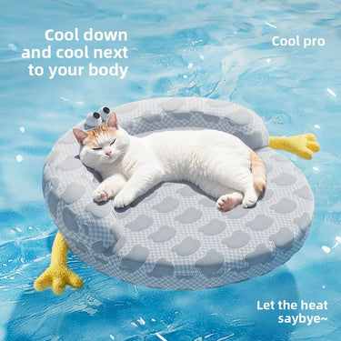 A relaxed cat lounges on the Ice Silk Cat Nest by KittyNook Cat Co., perfect for cooling off in the pool this summer.
